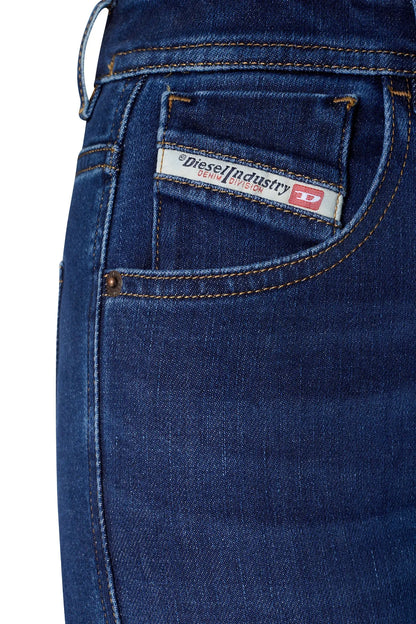 Blue denim jeans pocket detail with logo label and contrast topstitching