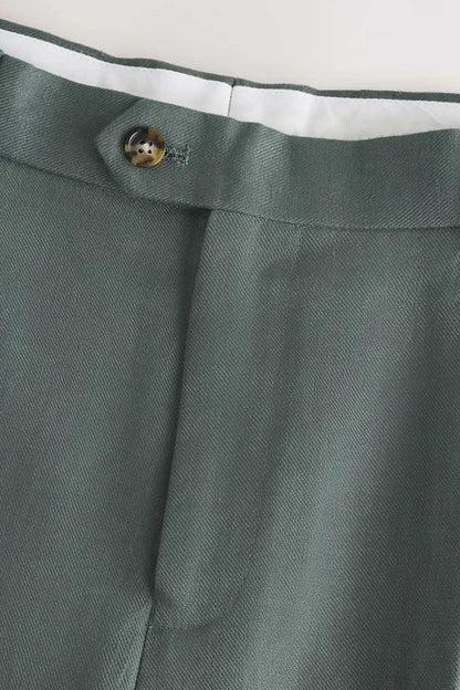 Green suit trouser waistband with button and fly facing