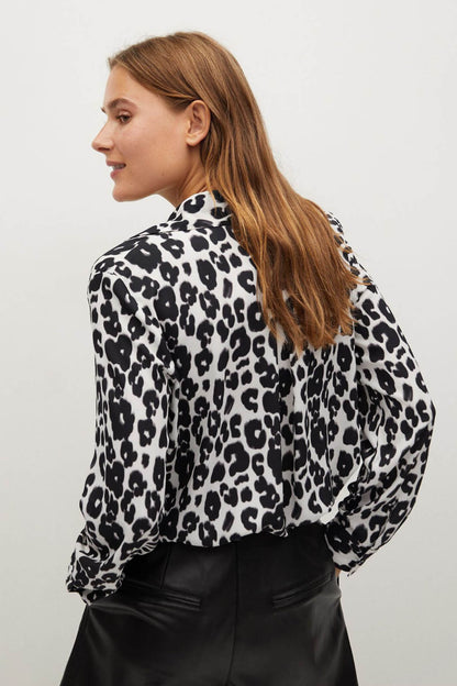 Black-and-white leopard-print blouse with long sleeves and collared neckline