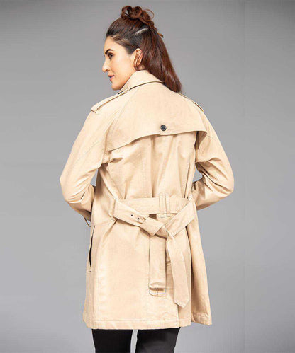 Tan trench coat back view with waist belt and flap collar