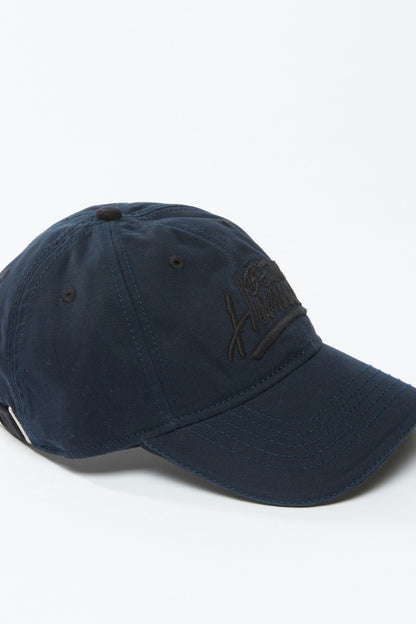 Navy blue baseball cap with curved brim and embroidered logo on front