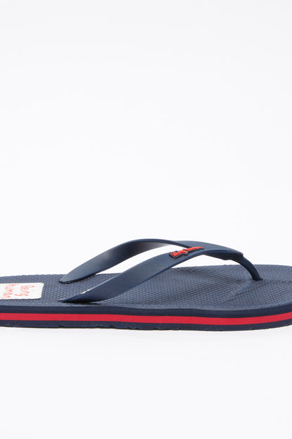 Navy flip-flop with red edge stripe, branded patch and curved thong strap