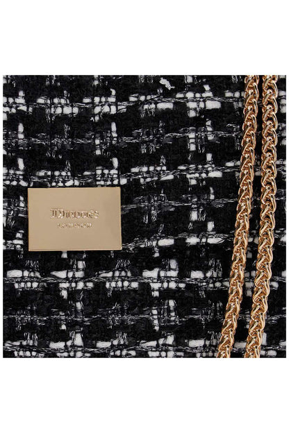 Handbag logo plaque on black tweed weave with white flecks and gold chain