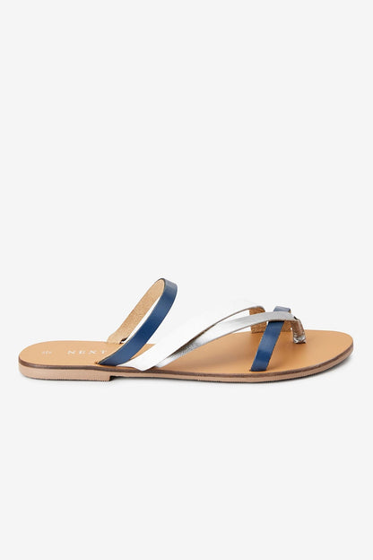 Navy and white thong sandals with flat straps and tan footbed