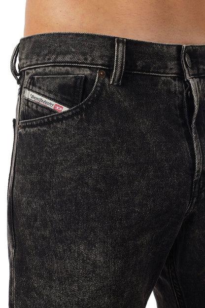 Charcoal denim jeans waistband with button closure and logo patch on coin pocket