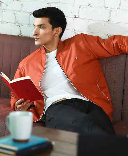 Rust-orange bomber jacket with zip front and long sleeves
