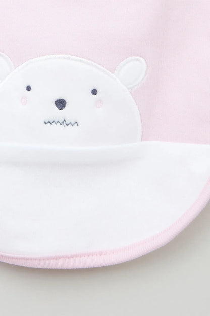 Pink and white baby bib with white bear face applique detail