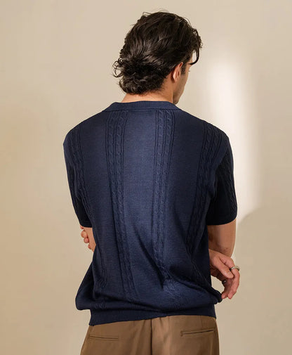 Fitted knit polo shirt back view, navy blue cable-knit texture, short sleeves