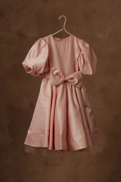 Pink puff-sleeve dress with gathered waist bow and flared skirt, hanging view.