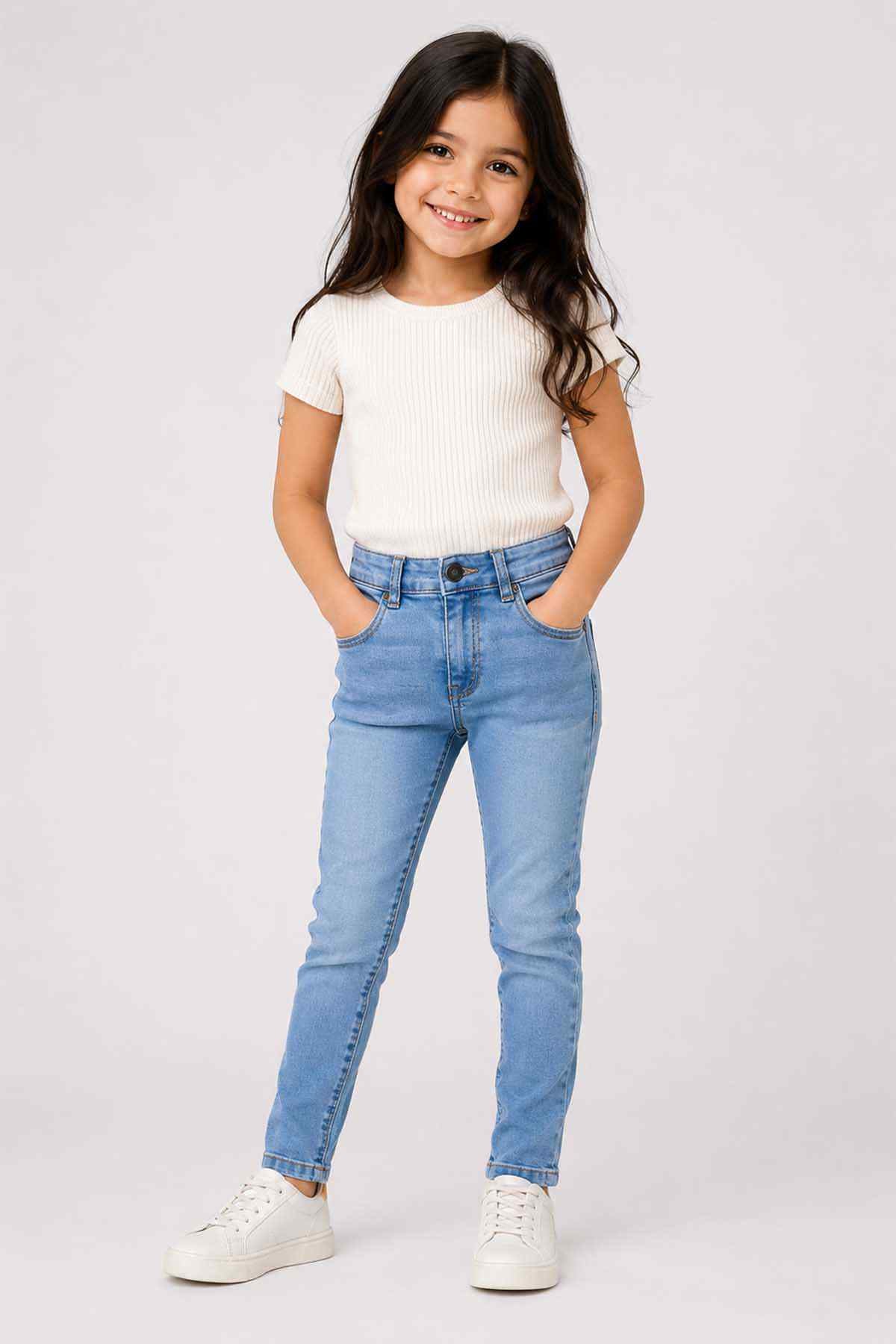 Kids blue denim jeans with cuffed hems, button fly, and belt loops
