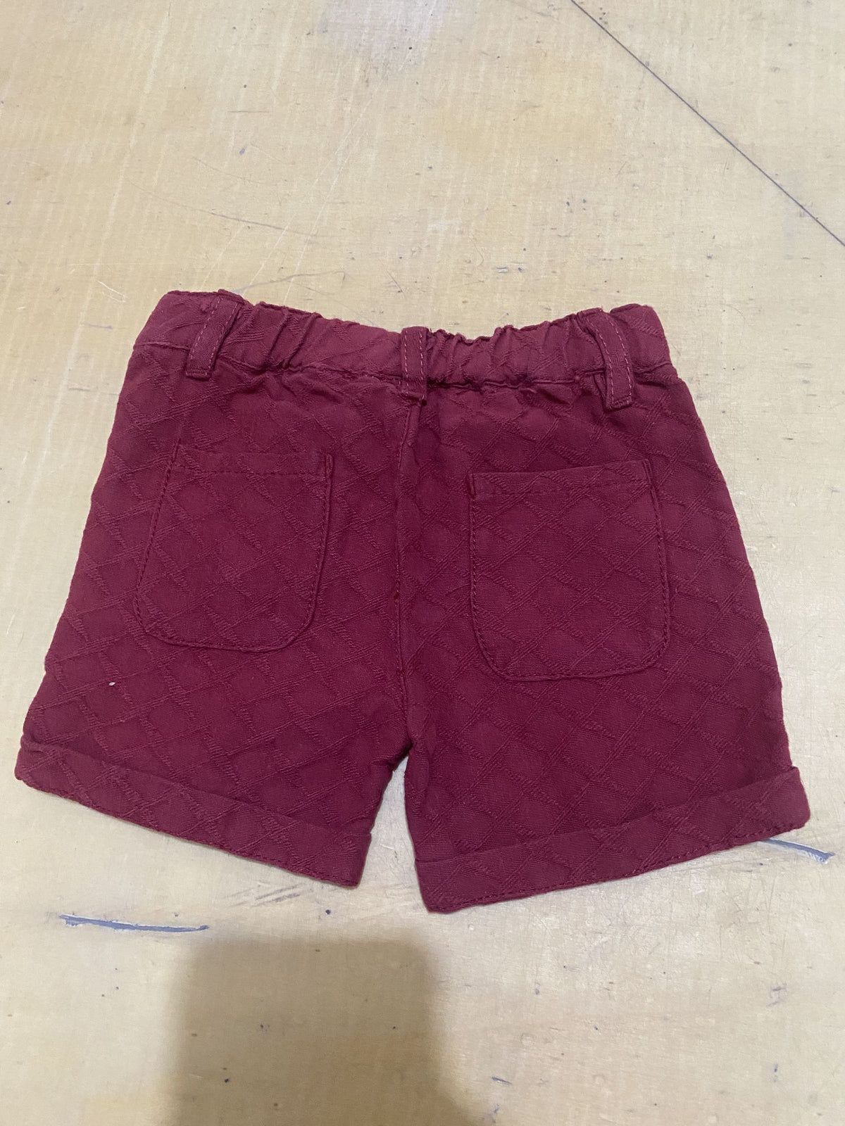 Burgundy kids shorts with elastic waist and back patch pockets