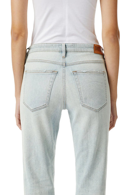 Light blue denim jeans with two front pockets and orange Diesel logo patch on waistband.