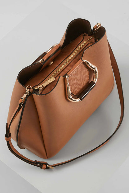 Brown leather tote bag with zip pocket, gold hardware, and long crossbody strap
