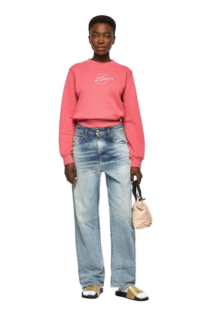 Model wearing light-wash wide-leg denim jeans with relaxed fit and belt loops