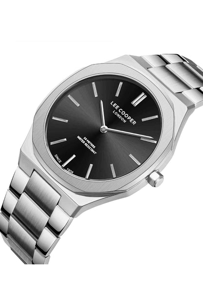 Silver stainless steel wristwatch, angled view of dark dial with baton markers and crown