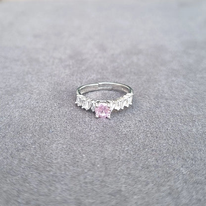Silver-tone ring with pink marquise center gemstone and white fringe detailing