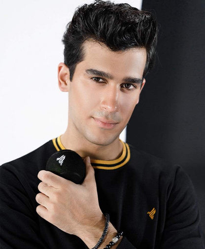 Fitted black sweatshirt close-up with ribbed yellow collar and chest logo