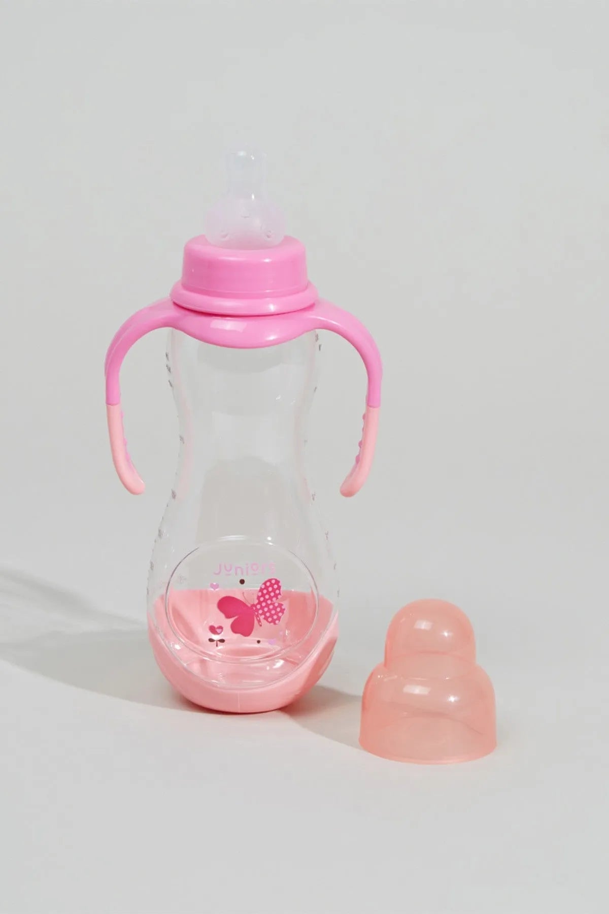 Pink-handled baby bottle with clear body, flip-top cap and two spare nipples