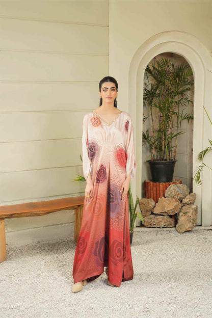 Blush pink maxi dress with long sleeves, V-neck, and maroon spiral print