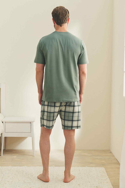 Men's green crewneck T-shirt and plaid drawstring shorts, back view.