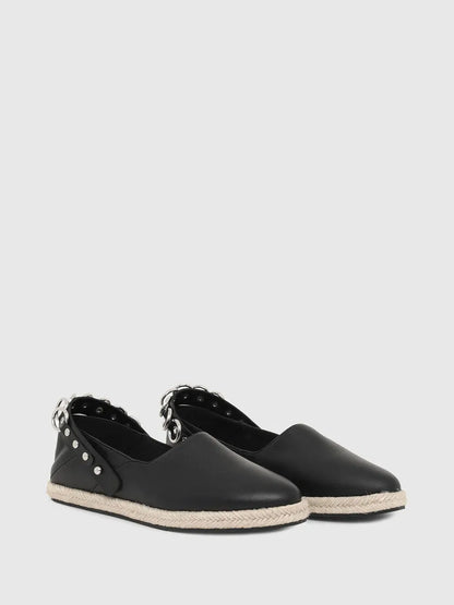 Pair of black leather espadrille slip-on sneakers with silver buckle straps