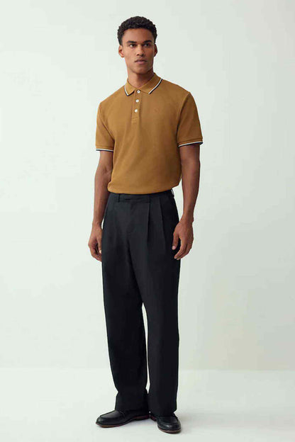 Tan polo shirt with white-and-navy trim, short sleeves