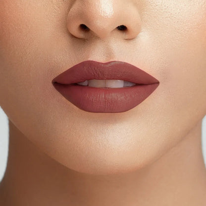 Conatural velvet lipstick on lips, mauve-brown nude shade