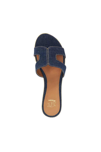 Navy denim slide sandals with two adjustable-look straps and tan footbed