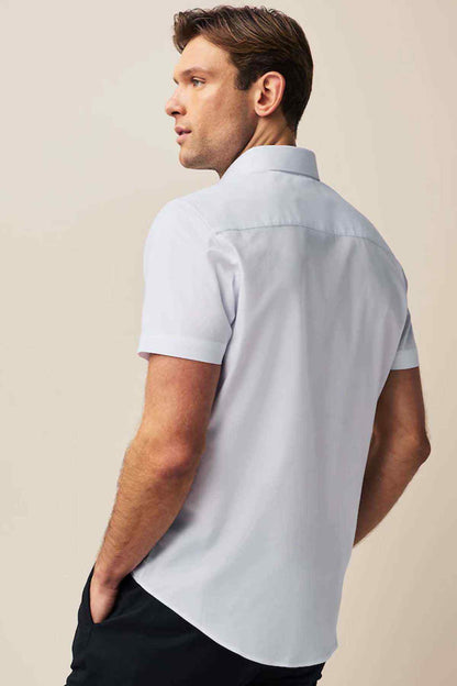 Men's white short-sleeve button-up shirt, side back view