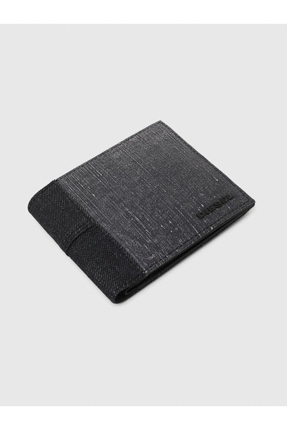 Dark denim bi-fold wallet, angled view with fold-over flap and stitched edge