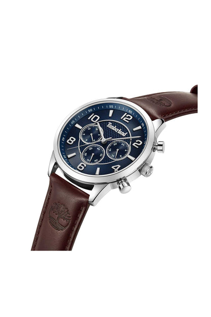 Blue dial wristwatch with silver case and brown leather strap, angled view