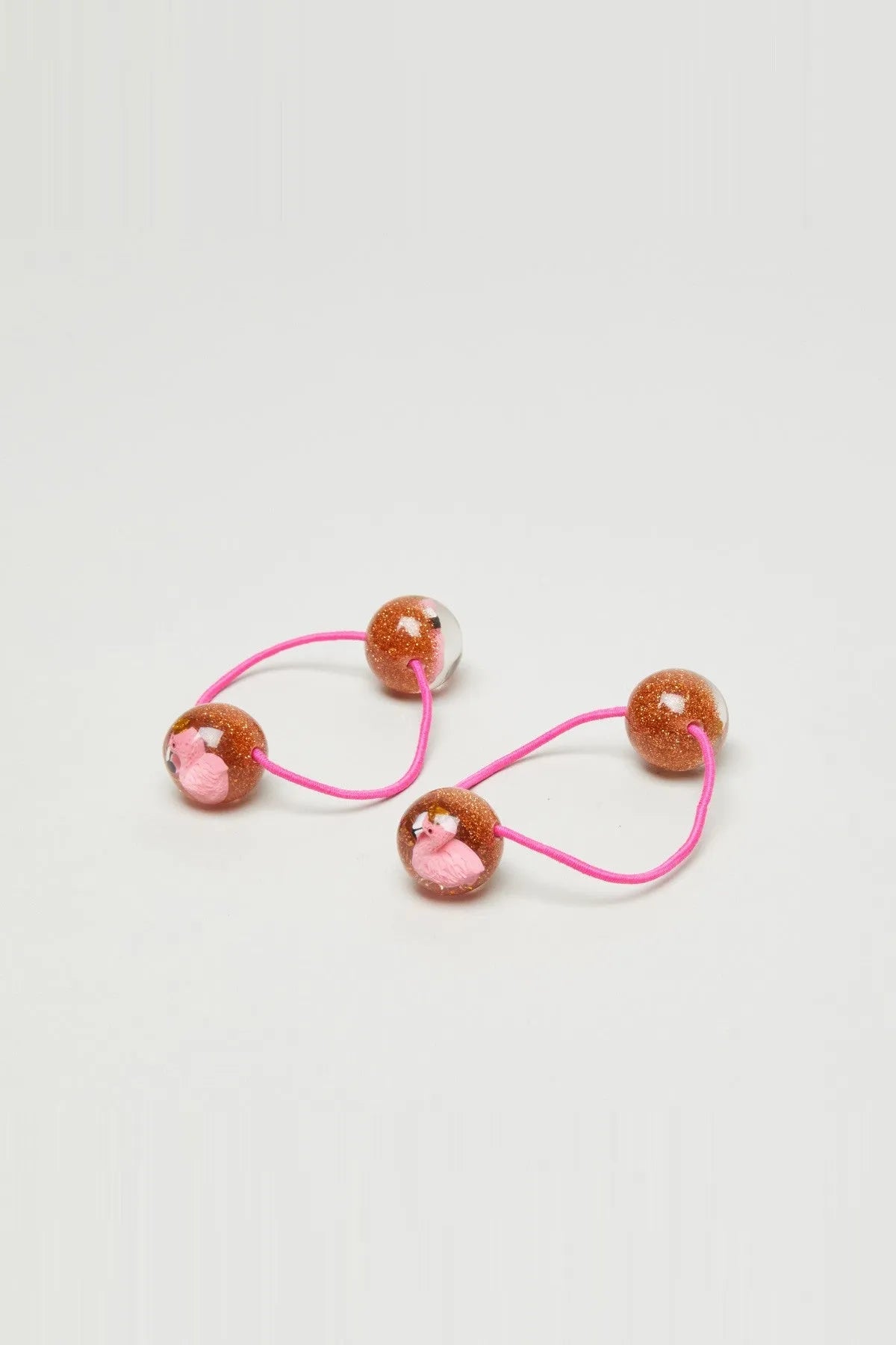 Set of 3 pink hair ties with glitter brown bead charms and small pink pig faces