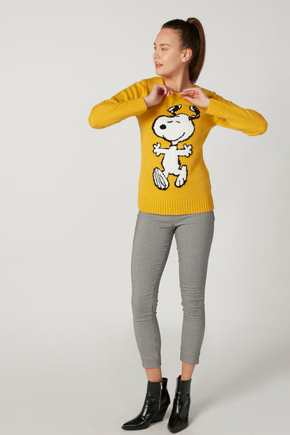 Yellow knit sweater with full cartoon dog graphic, crew neck, long sleeves; paired with gray pants.