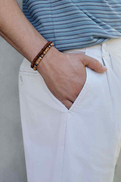Light beige chino trousers detail, hand pocket and button fly