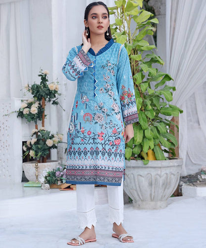 Blue printed tunic dress with V-neck and border trim, 3/4 sleeves, worn with white pants
