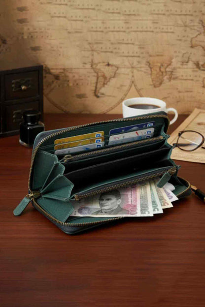 Olive green leather zip wallet open, showing card slots and compartments