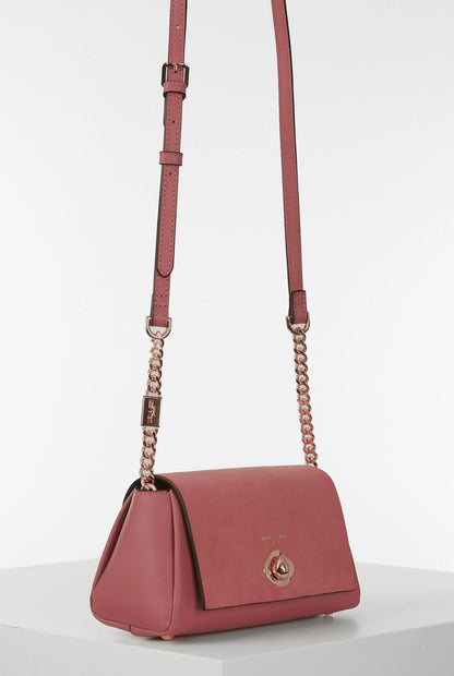 Pink crossbody flap bag with long chain strap and gold-tone logo clasp