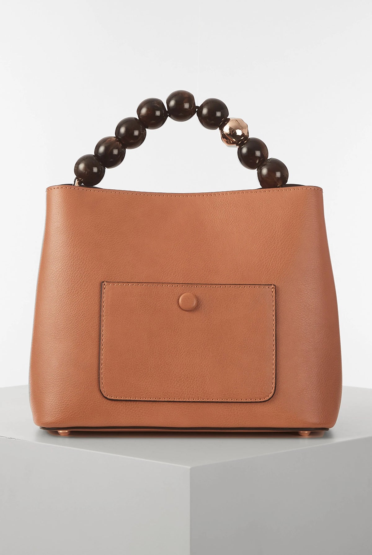 Brown leather bucket handbag with front snap pocket and beaded top handle
