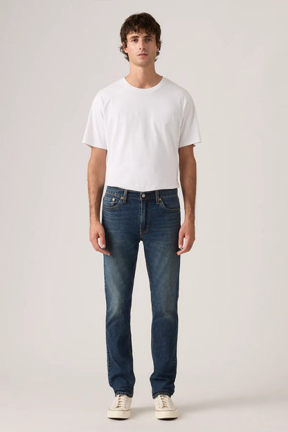 Levi's dark indigo jeans with button fly, belt loops, and straight legs