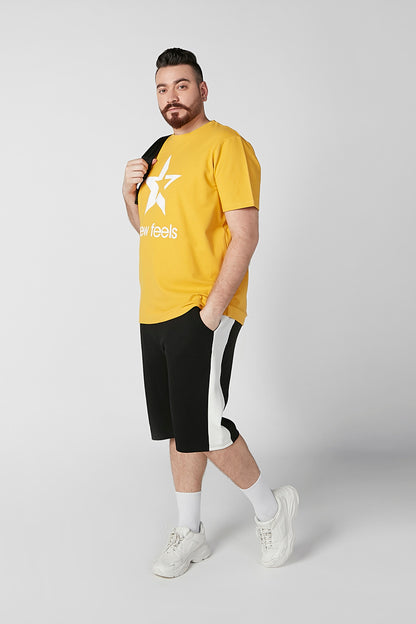 Yellow T-shirt with large white star graphic and 'new feels' text on chest