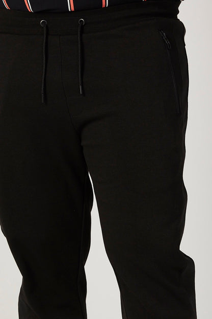 Splash black jogger pants close-up: drawstring waistband, zip side pocket