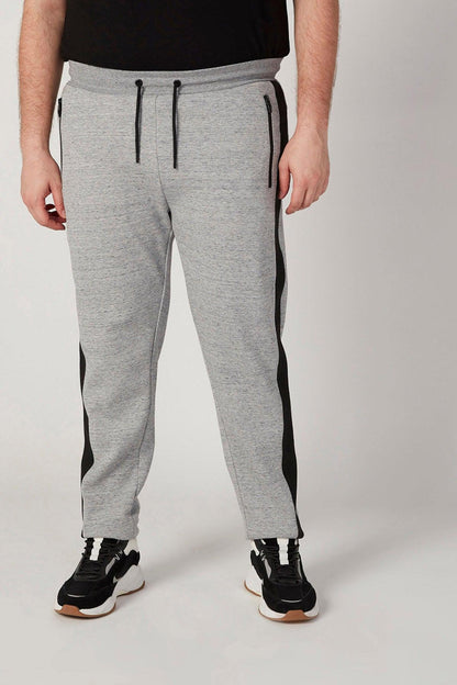 Grey sweatpants with drawstring and black side stripe, cuffed hem