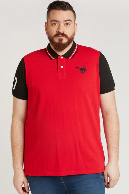 Men's red polo shirt with black sleeves, striped collar and chest bird logo.