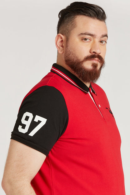 Men's red polo shirt with striped collar, black sleeve '97' and bird logo on chest.