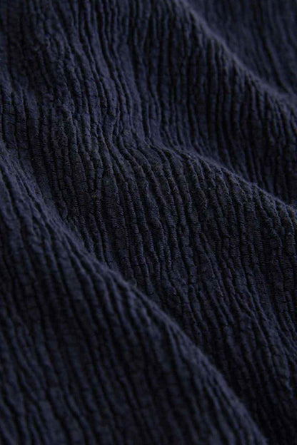 Navy textured knit fabric with vertical ribbed pattern
