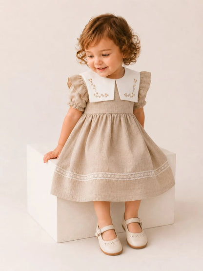 Girls stone linen dress with puff sleeves, white embroidered collar, and full skirt