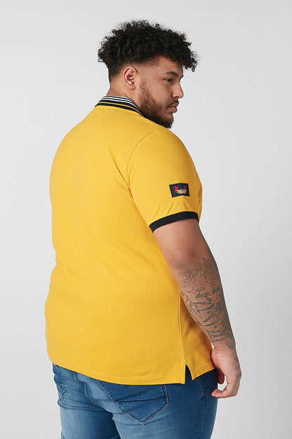 Men's yellow polo shirt with striped collar and dark sleeve cuffs