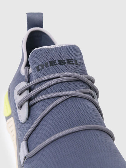 Blue sneaker close-up with gray laces and DIESEL logo on the tongue