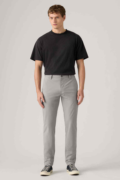 Men's grey jeans, front view with belt loops and button closure