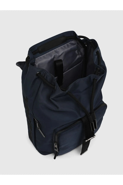 Navy backpack with open top, inner pocket, and multiple zip compartments